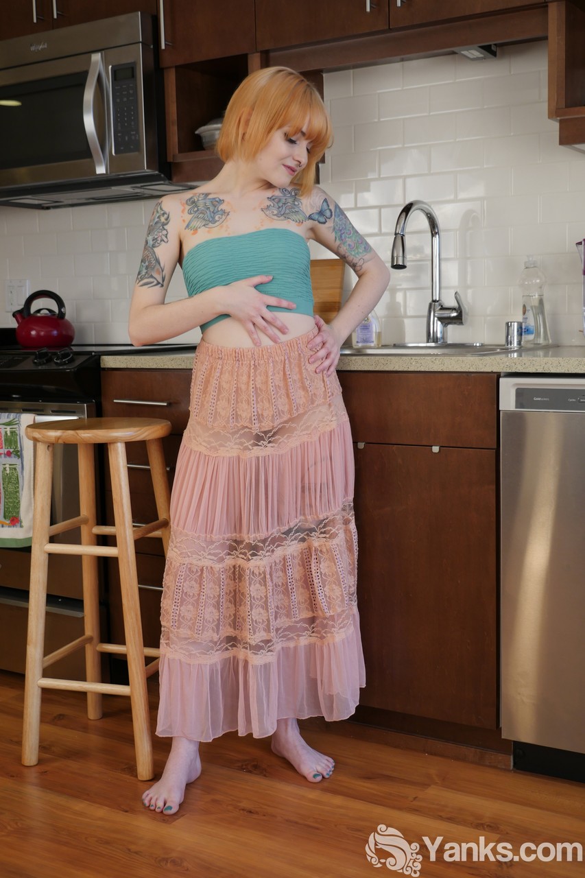 Alt model with a tattooed body Danae Kelley fingering her pussy in the kitchen foto porno #423319426
