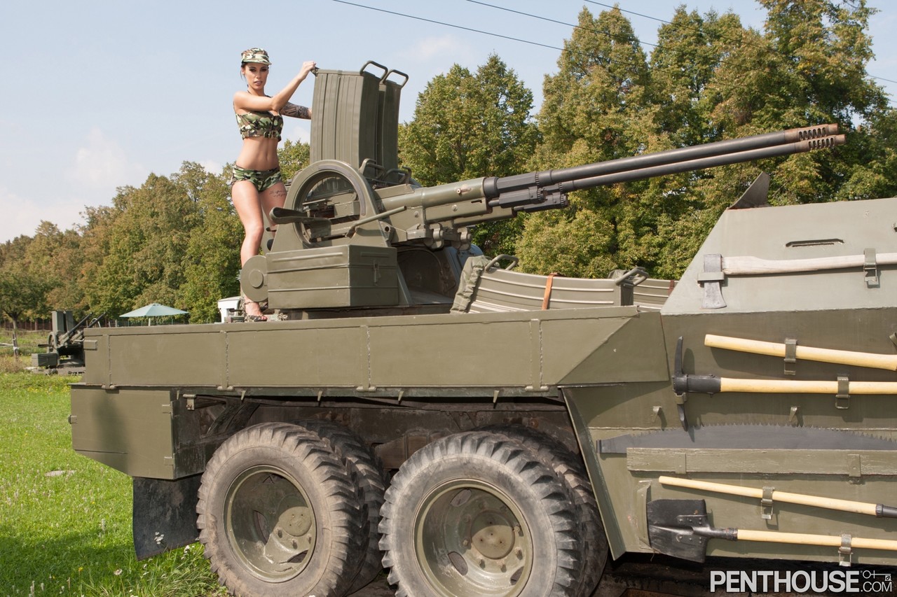 Kinky army woman Nikita Bellucci enjoying an outdoor FMM 3some on a tank porn photo #422497203
