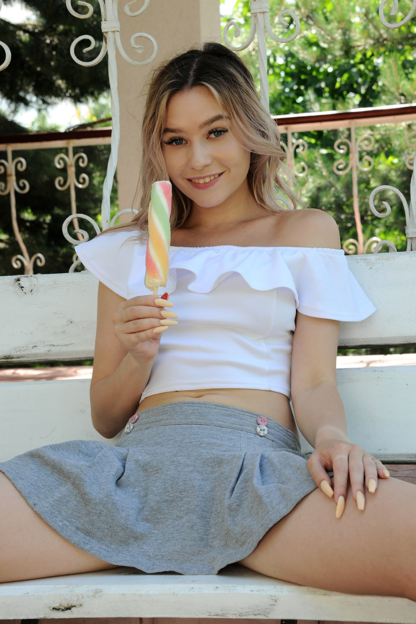 Cute blonde teen Angelina Ash licks an ice cream while stripping outdoors photo porno #424037734