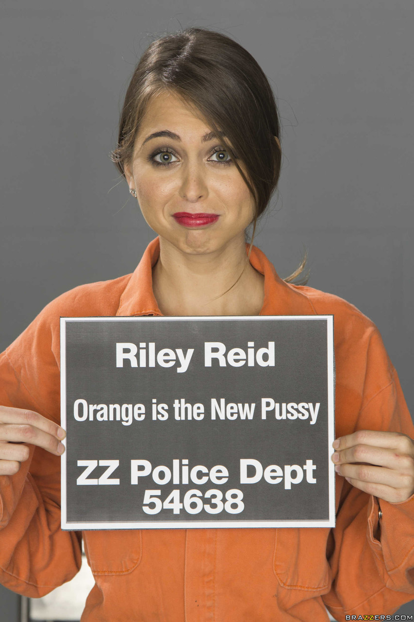 Petite female Riley Reid rips off her prison jumper to model in the nude porn photo #427252664