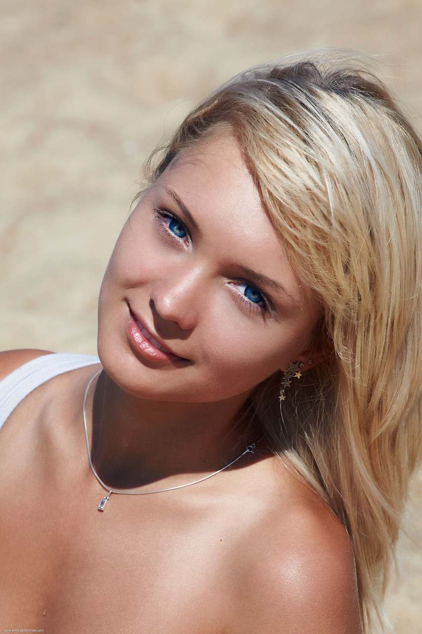 Adorable blonde Lada displays her beautiful shaved pussy on a sandy beach foto porno #424768175