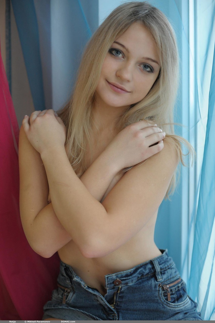 Sweet blonde teen Natja gets naked by a window in a casual manner ポルノ写真 #426012735
