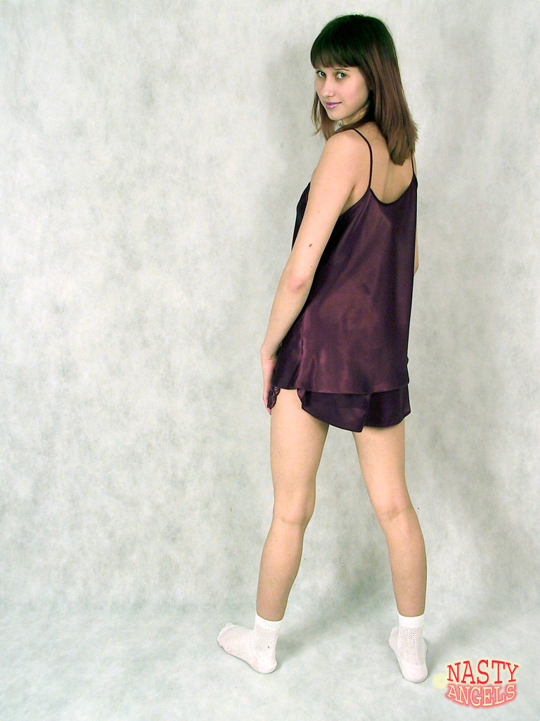 Brunette teen Angelina gets rid of her nightgown and poses in her white socks порно фото #428220202