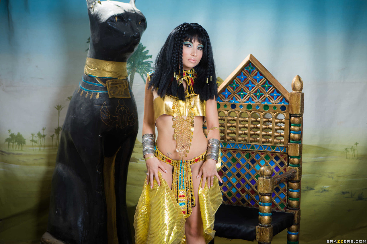 Bum and boo: Petite Asian Rina Ellis shows off her body in Cleopatra costume.