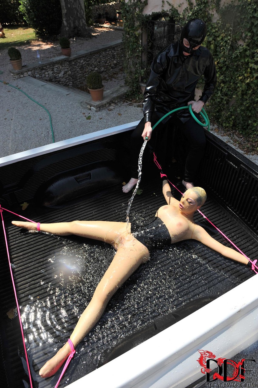 British girl in latex Latex Lucy gets tied on a truck & water jetted in BDSM porno fotoğrafı #422511923