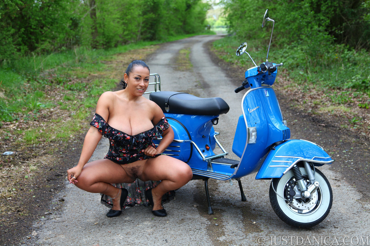 Curvy MILF Danica Collins shows her giant tits on a motorcycle in the woods photo porno #428399700