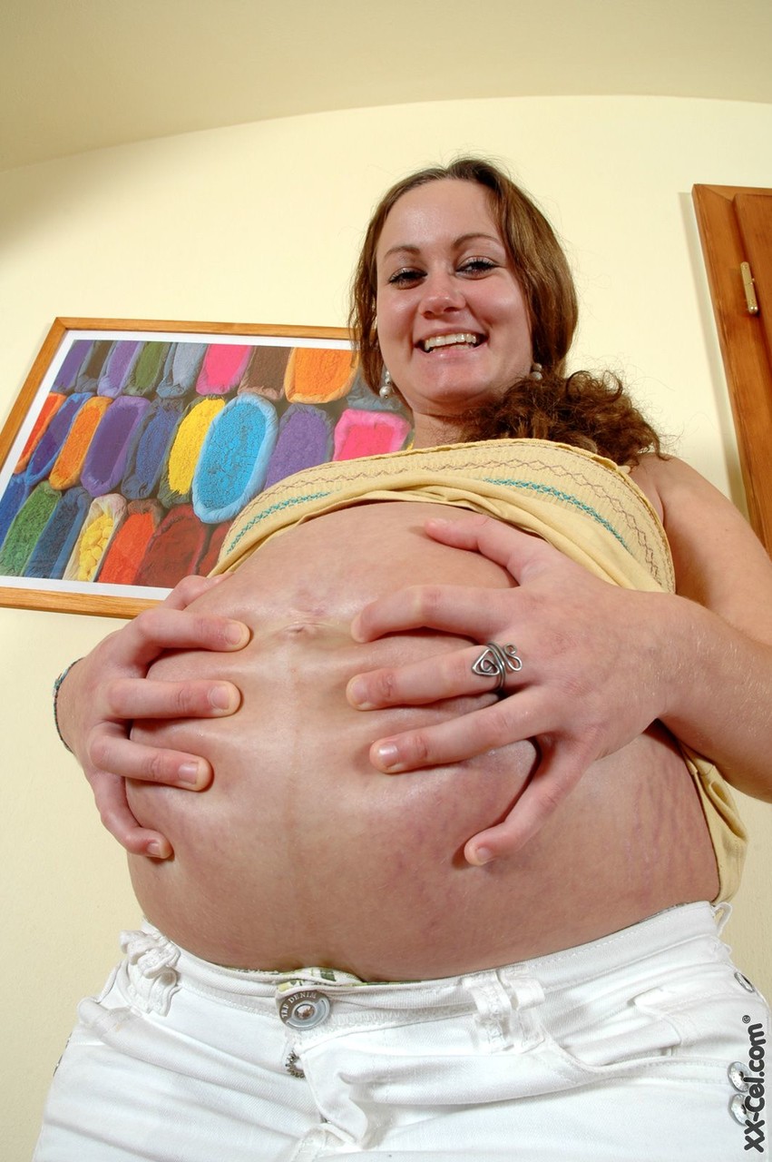 Charming Preggo Julie Revealing Her Big Belly And Bald Cock Craving Pussy