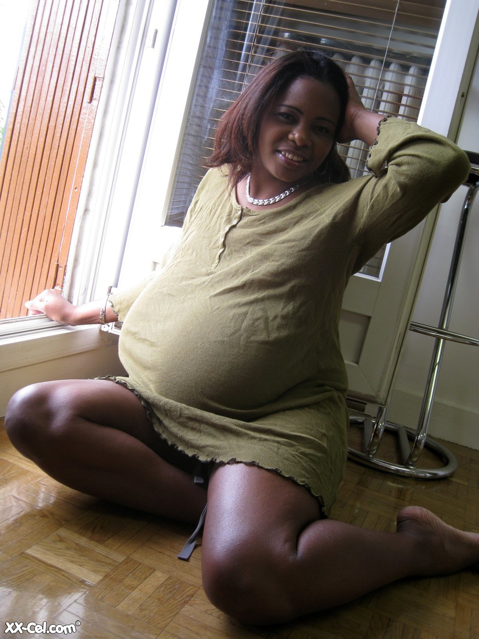 Ebony wife Miosotis Claribel strips and exposes her tremendous breasts zdjęcie porno #423623663