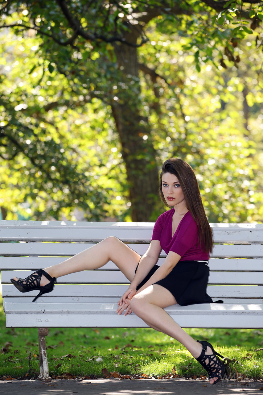 Stunning European babe Serena poses on a park bench in a sexy short skirt foto porno #428852553
