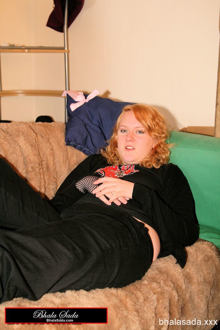 Redheaded fatty strips her sweatshirt and shows her cleavage in a black bra porn photo #422572699