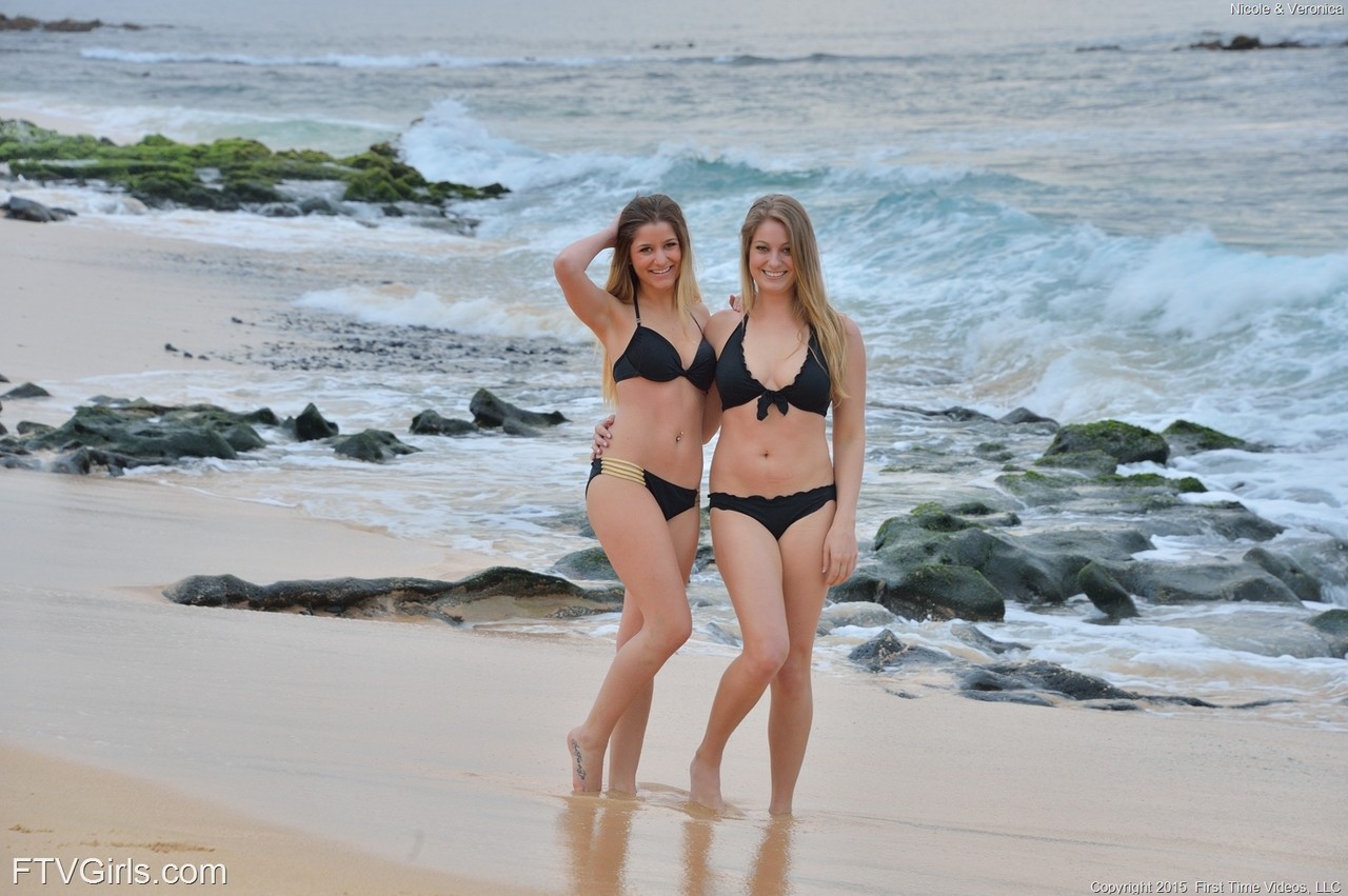 Delightful babes Nicole and Veronica kiss and pose while stripping on a beach порно фото #422504351