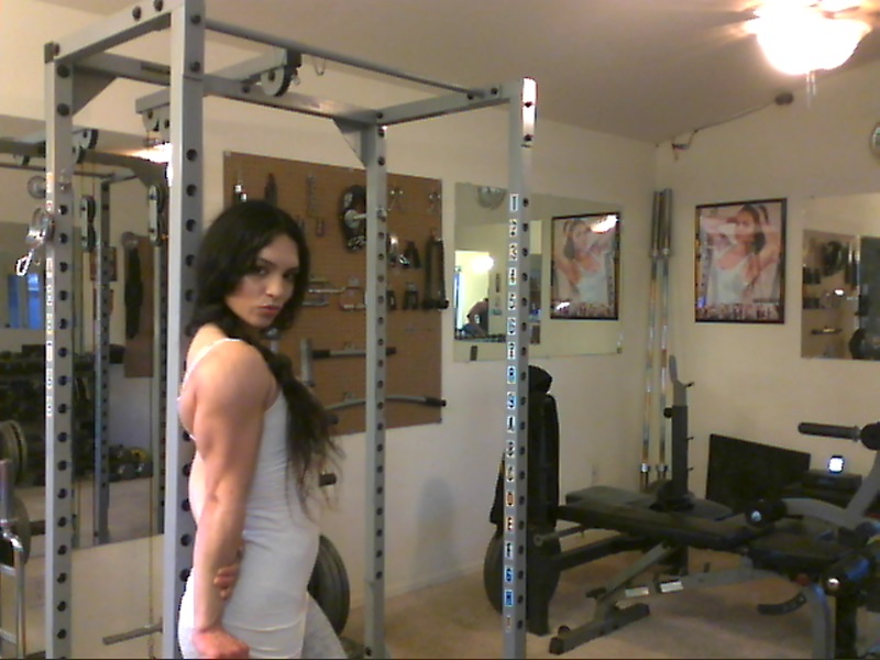 Sweet babe with amazing abs Tia flaunts her biceps at a home gym porn photo #426787163