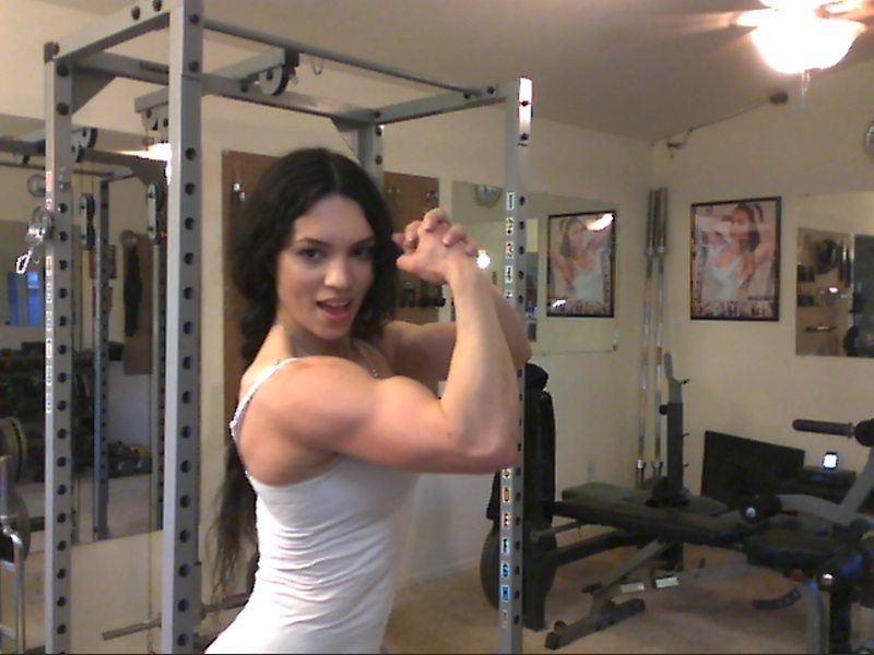 Sweet babe with amazing abs Tia flaunts her biceps at a home gym porn photo #426787169