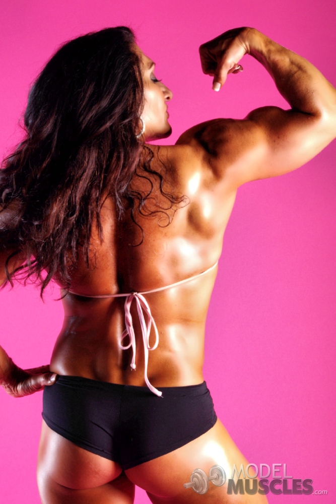 Tanned bodybuilder Tonia Moore shows her muscles while lifting weights porn photo #425656878