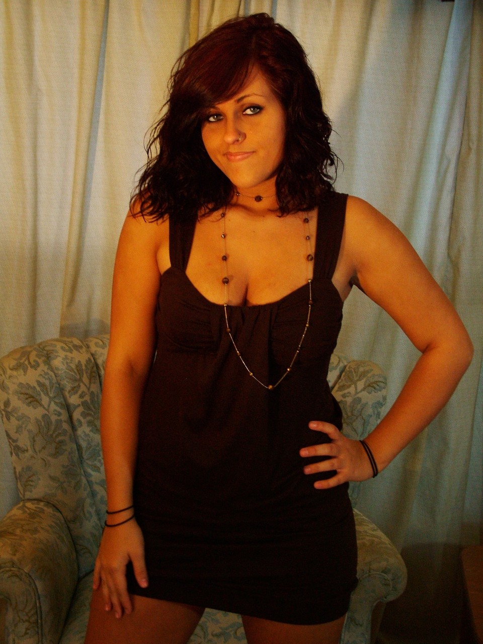 Sexy raven-haired teen going topless and showing her big juicy tits