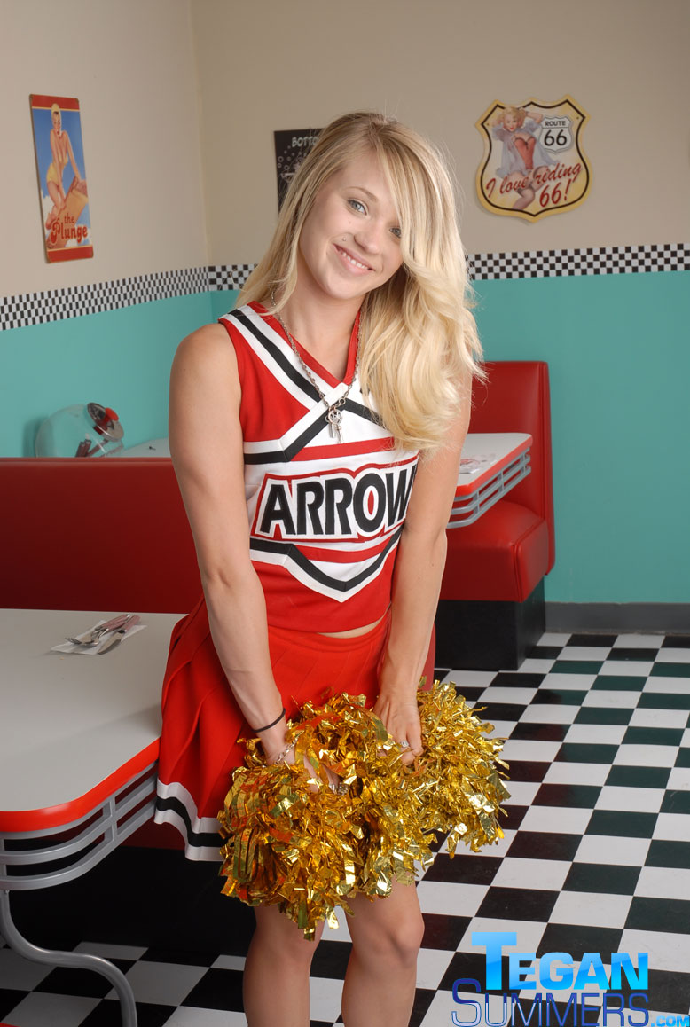 Cute college blonde Tegan Summers poses in a cheerleader outfit at a diner porn photo #422725265