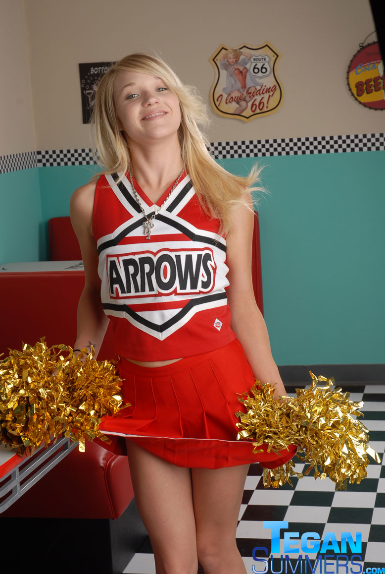 Cute college blonde Tegan Summers poses in a cheerleader outfit at a diner porn photo #422725274