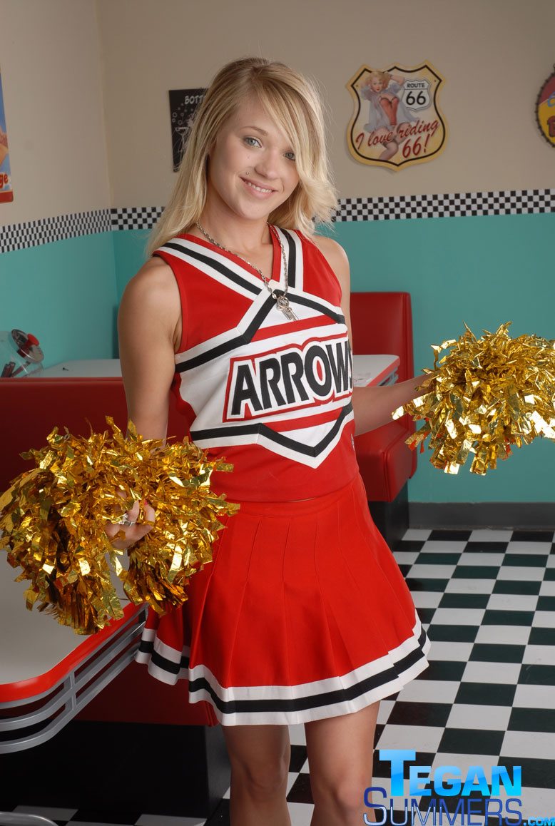 Cute college blonde Tegan Summers poses in a cheerleader outfit at a diner porn photo #422725308