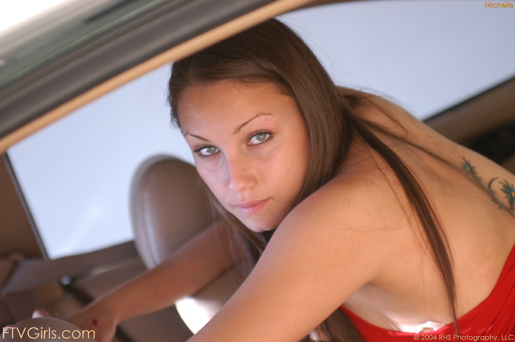 Pretty babe Michelle slips out her puffy nipple and shows her ass in the car porn photo #422949032