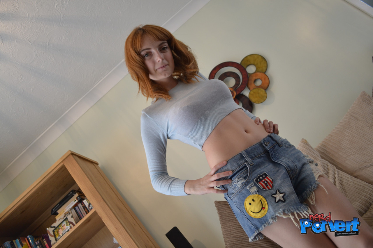 Redheaded Vixen Strips Her Clothes Off And Gives A Perverted Nerd A Bj