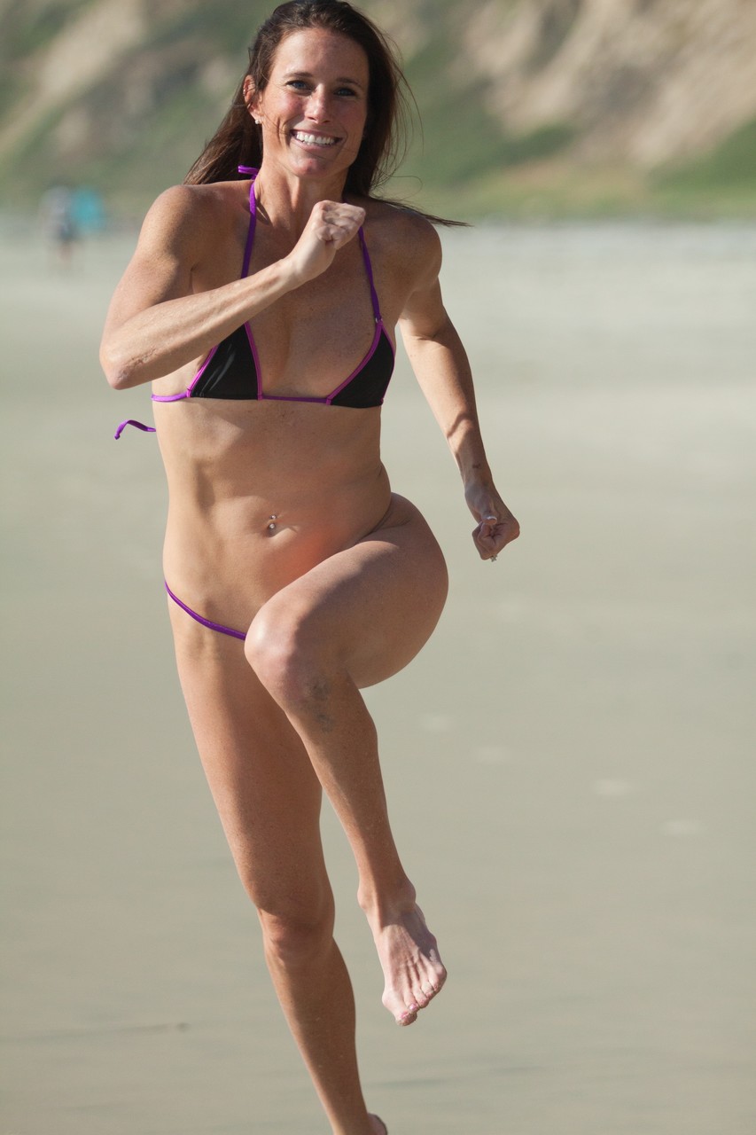 Sexy all-natural mature Sofie Marie runs on the beach in a very skimpy bikini photo porno #426528353