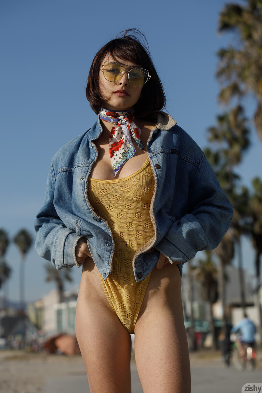 Adorable teen Basil Navas poses on the beach in yellow see-through bodysuit 포르노 사진 #427997471