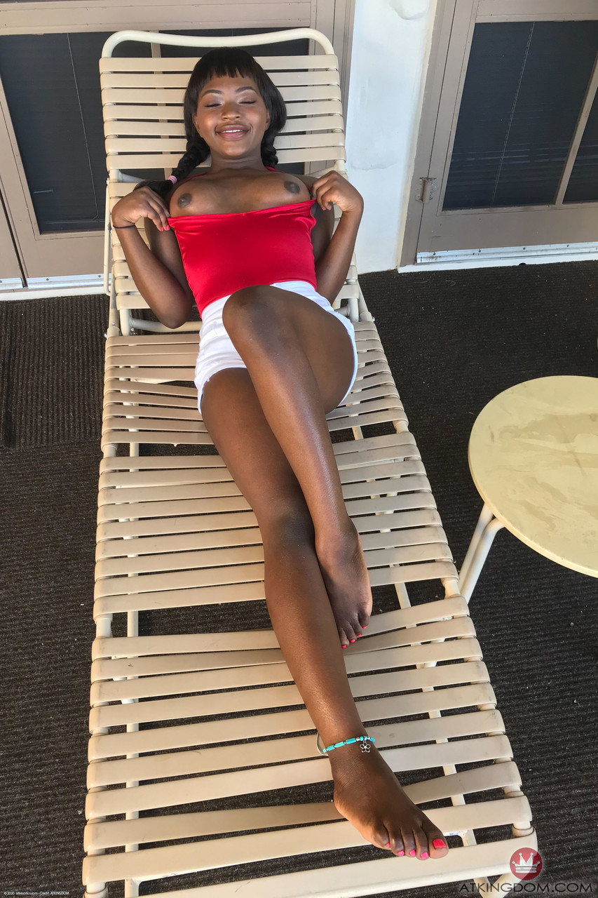 Petite ebony Noemie Bilas exposing her tits, pussy and feet in a solo порно фото #423892552
