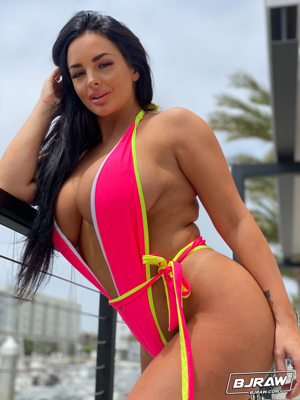 Babe with grand breasts Jessica Annelle poses in a pink swimsuit outdoors порно фото #424900321