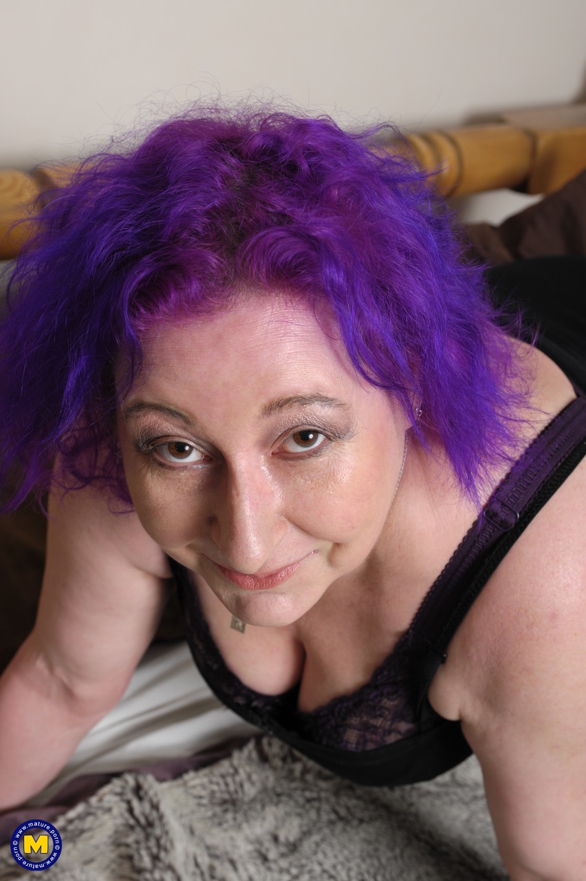 Mature with purple hair Nataline shows off her big boobs & plays with tiny toy porno foto #428340405