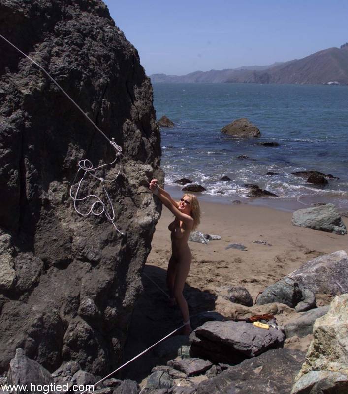 Nude mature slave Sadie Belle gets tied to a huge rock on the beach foto porno #425593707