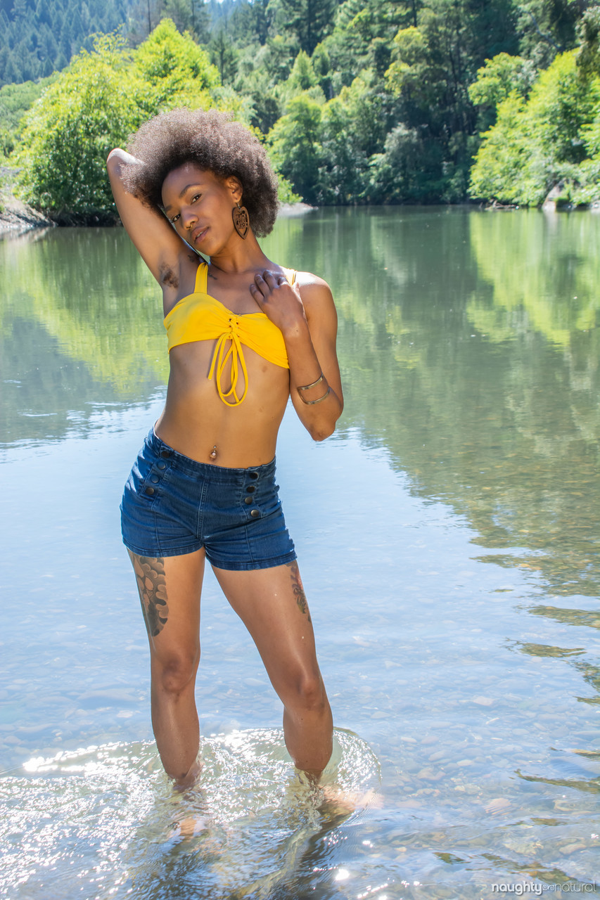 Afro-American babe Nikki Darling exposes her hairy inked body in the river porn photo #427122522