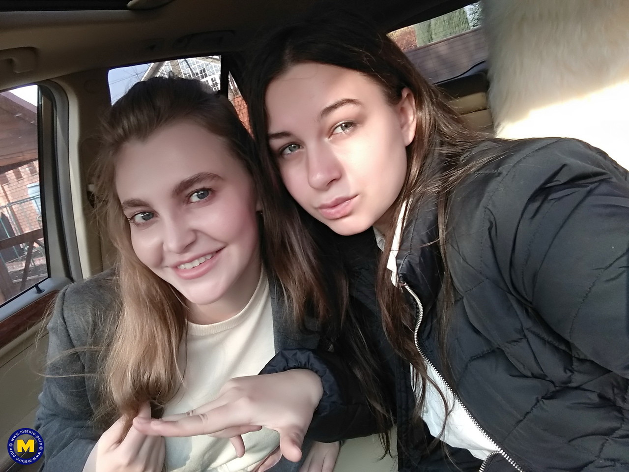 Long haired European lovers take a selfie in the car before lesbian sex action 포르노 사진 #427416621