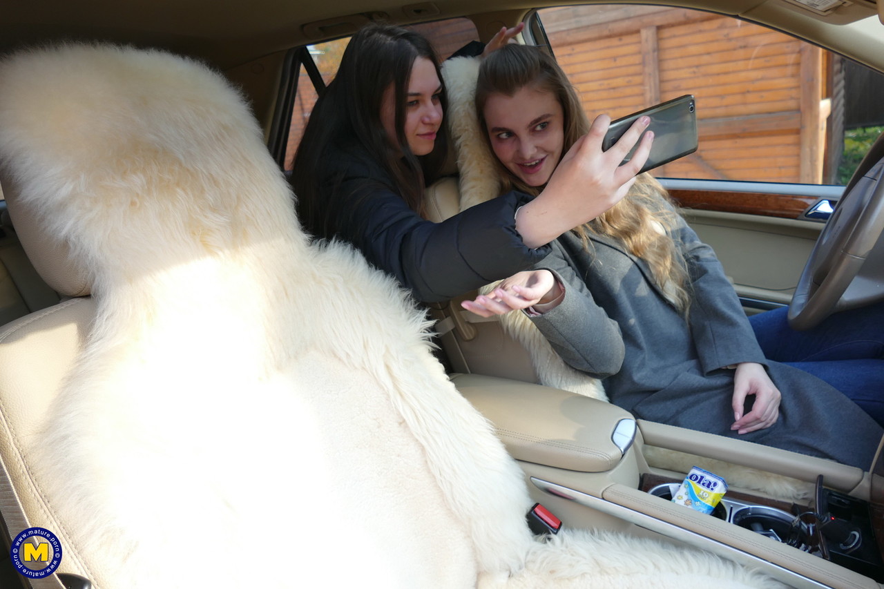 Long haired European lovers take a selfie in the car before lesbian sex action porn photo #427416705