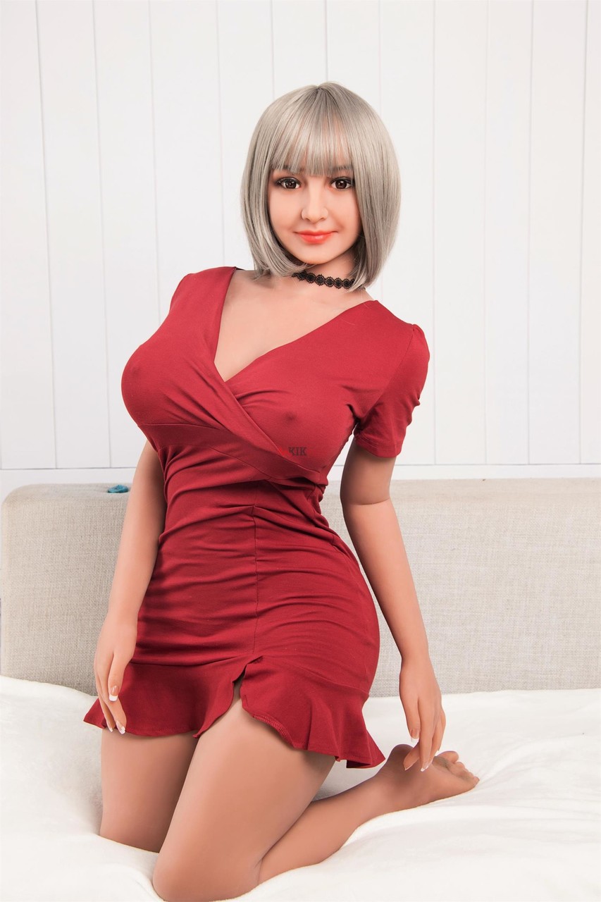 Curvaceous Sex Doll Flaunts Her Big Tits In A Sexy Dress While Naked