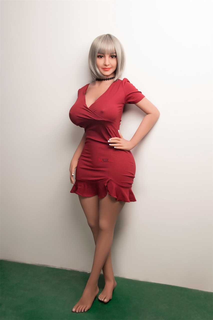 Curvaceous Sex Doll Flaunts Her Big Tits In A Sexy Dress While Naked