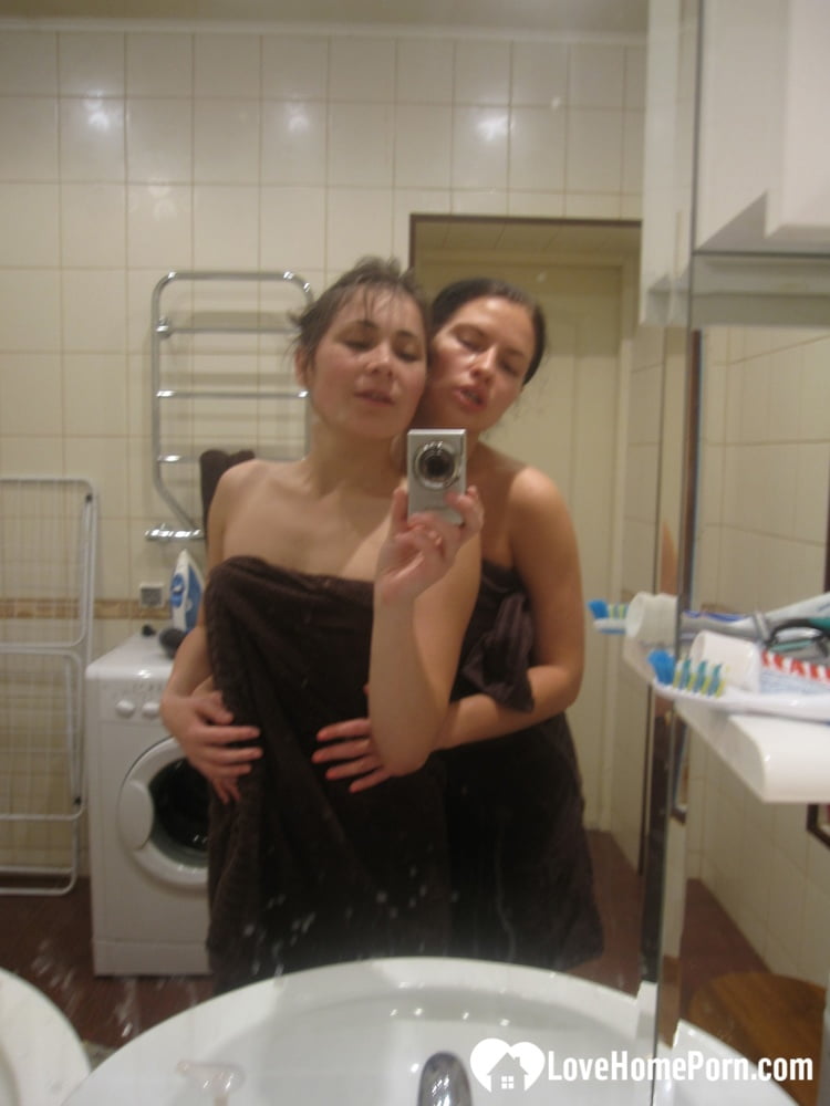 Hot amateur lesbians strip and make out while taking selfies in the bathroom porn photo #424818108