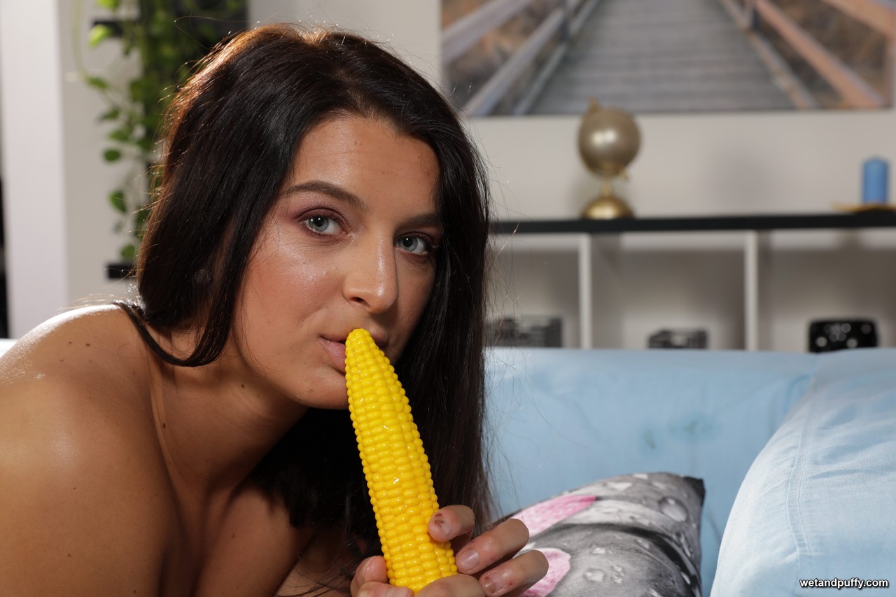 Brunette sweetie Juliia flaunts her hot ass and toys with a corn shaped dildo porn photo #427143971