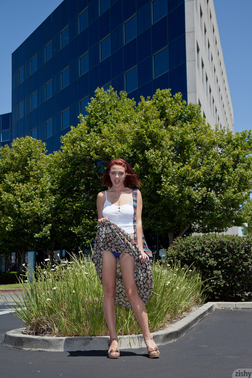 Redhead girlfriend Jessica Robbin grabs her big naturals in the store foto porno #427036139