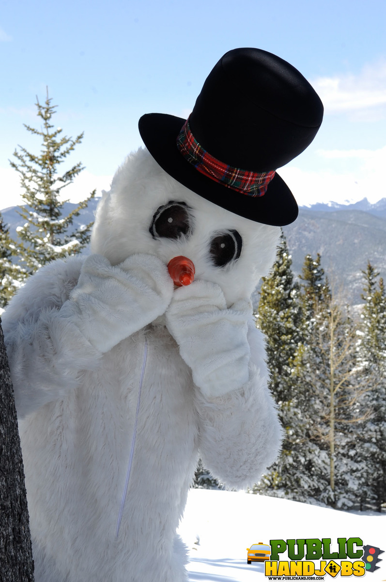 Naughty redhead Brandi de Lafey gives a snowman a CFNM handjob in the woods porn photo #422743154