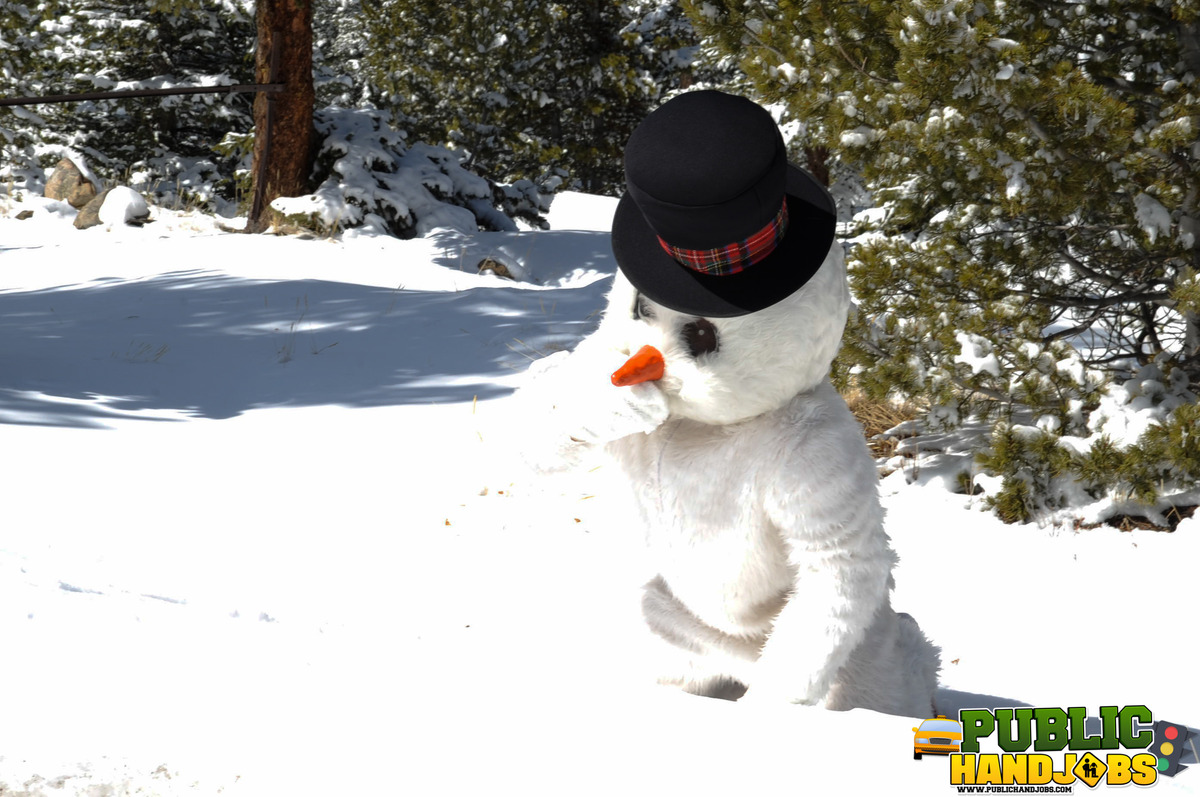 Naughty redhead Brandi de Lafey gives a snowman a CFNM handjob in the woods porno foto #422743144