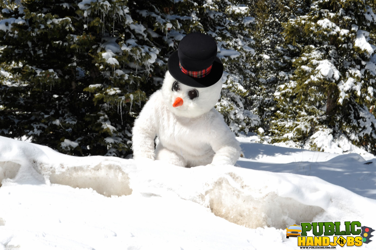 Naughty redhead Brandi de Lafey gives a snowman a CFNM handjob in the woods porno foto #422743159