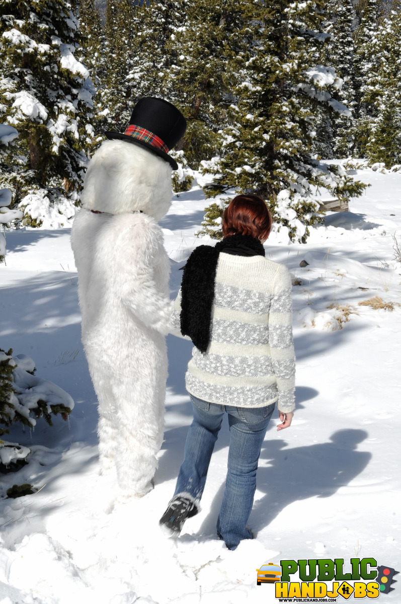 Naughty redhead Brandi de Lafey gives a snowman a CFNM handjob in the woods porno foto #422743165