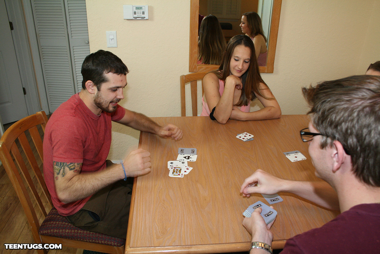 All-natural teens give a lucky nerd a double handjob while playing cards