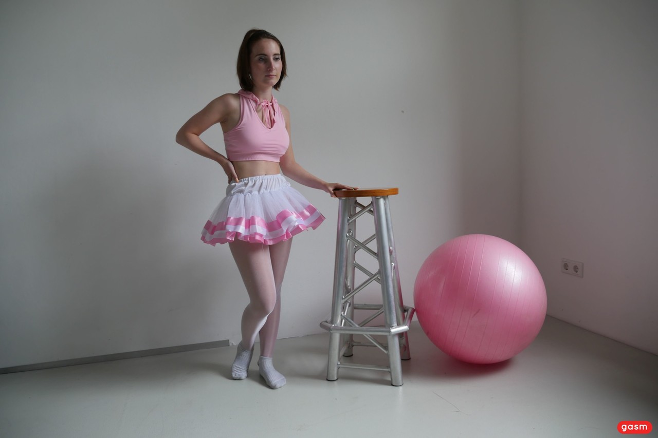 A brunette ballerina named Lia Louise teases her tutu while sucking into her dance instructor's penis.