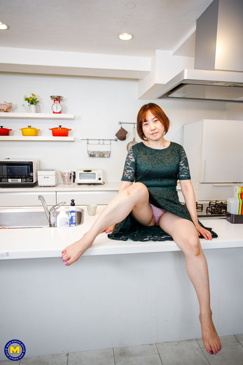 Asian Housewife Yuki Kozakura Shows Her Shaved Pussy In The Kitchen
