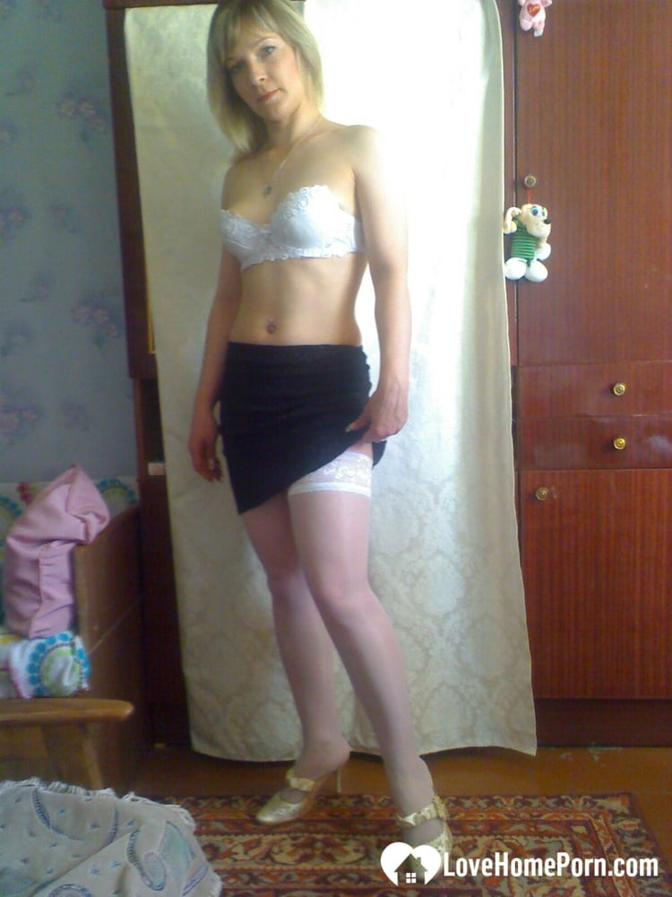 An adult educator who is horny and spreading her infected pussy on the bed.