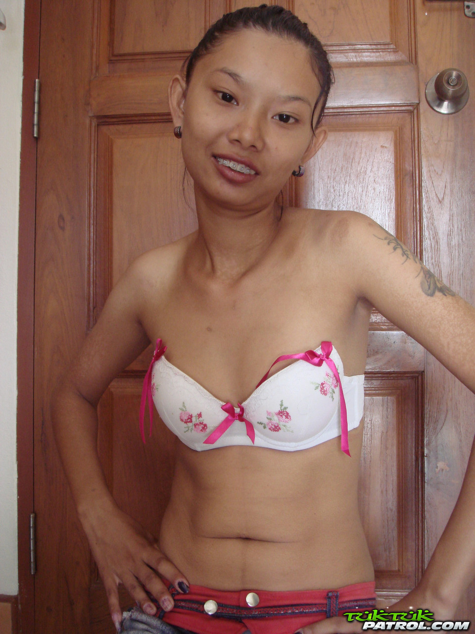Skinny Asian Babe Tik Unveils Her Tiny Tits And Her Shaved Pussy