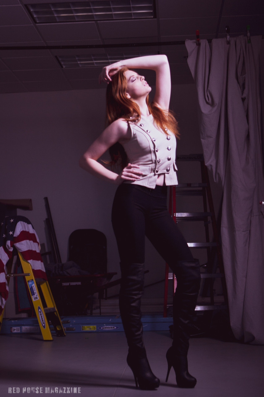 Redheaded Model Shaun Tia Posing In Her Sexy Blouse Pants And High Heels