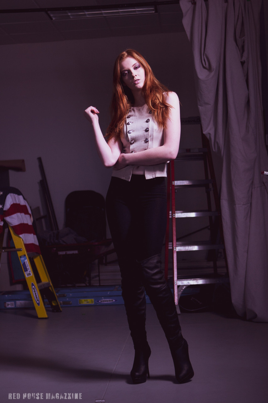 Redheaded Model Shaun Tia Posing In Her Sexy Blouse Pants And High Heels