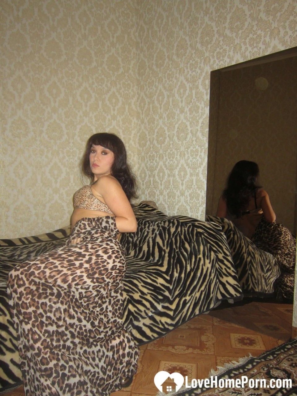 A well-kept young brunette with a stunningly beautiful round anus shows off her dress and indulges in some self-pleasure.